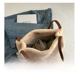 Macro detail of plush tote bag interior showing ample space for phone and umbrella