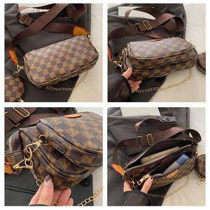 Detail view of brown checkered crossbody bag with adjustable strap and coin purse