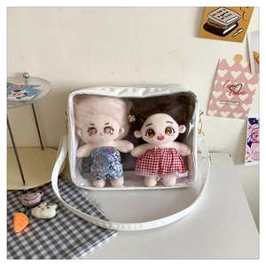 Detail view of white Japanese style ita bag with transparent window and metal buckles
