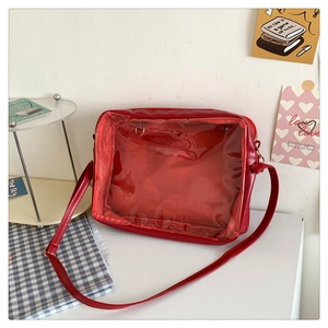 Macro detail of red PU leather Itabag with transparent PVC window for badge display