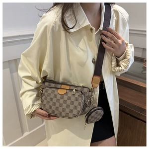 Close-up of three-in-one crossbody bag featuring classic T-pattern jacquard and leather details