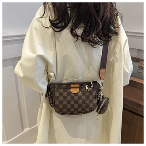 Detailed back view of a three-in-one brown checkered crossbody bag with chain detail