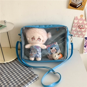 Blue ita bag with large transparent window and adjustable shoulder strap for display