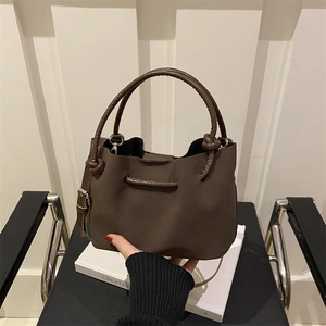 Minimalist vintage dark brown leather bucket bag with top handle and adjustable strap