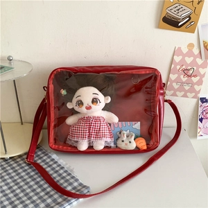 Red Japanese school style crossbody ita bag with large clear PVC window and plush doll interior