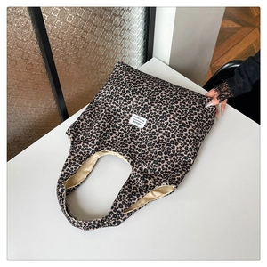 Detail shot of the vintage leopard print tote bag with a fashion label on canvas