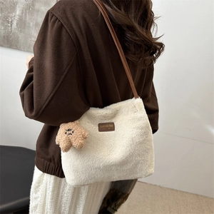 Winter faux fur shoulder bag in creamy white with brown leather strap and bear charm