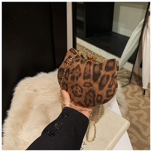 Detail of leopard print kitty shaped clutch with gold chain and rhinestone clasp