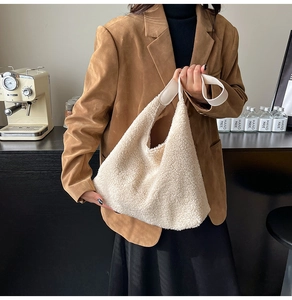 Detail of soft cream plush tote bag with smooth shoulder strap for winter commuting style