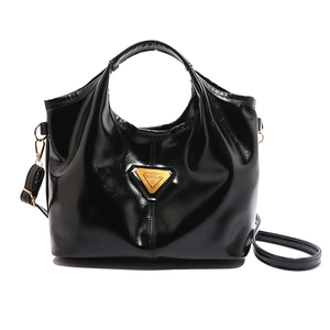 Retro black patent leather tote bag with gold triangle logo and crossbody strap