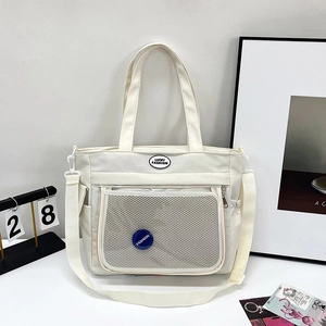 Borsa tote minimalista in tela bianco crema con tasca a rete e tracolla regolabile