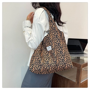 Fashionable leopard print tote bag shown on model highlighting the large capacity size