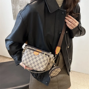 Retro shoulder bag with logo pattern and detachable coin purse on a wide fabric strap