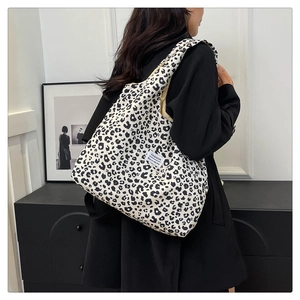 Black and white leopard print tote bag showing large capacity and fashion label