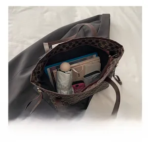 Macro view of the large capacity interior of this vintage print tote bag for daily essentials