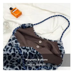 Detail of leopard print plush tote bag showing magnetic snap closure and soft faux fur