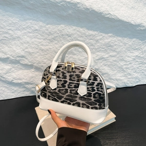 Elegant leopard print shell bag with white leather trim and gold zippers for women