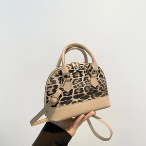 Fashionable leopard print shell bag with apricot leather trim and adjustable strap