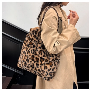 Leopard print plush tote bag worn by a model in a stylish khaki trench coat