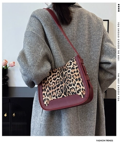Shoulder bag showing stylish combination of leopard print and burgundy faux leather finish