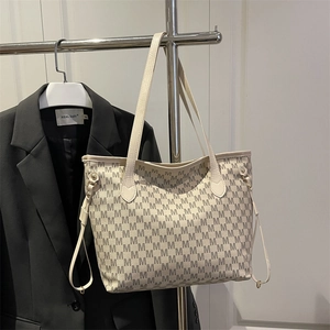 Large cream tote bag with stylish M-letter monogram print and spacious top-handle design