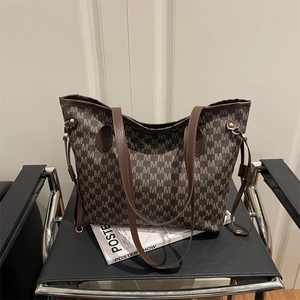 Large capacity tote bag with brown M-pattern monogram and side drawstring details