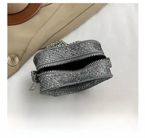 Internal view showing the capacity of the heart-shaped mini silver rhinestone chain bag