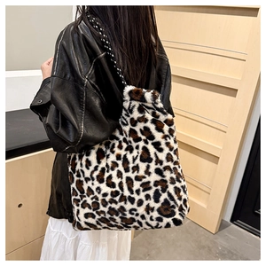 Macro detail of plush leopard print faux fur tote bag with stylish braided shoulder straps