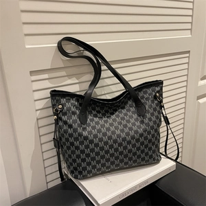 Large black tote bag with gray M letter print and gold hardware for daily commuting