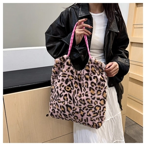 Detailed close-up of pink leopard plush tote bag with unique woven rope handles