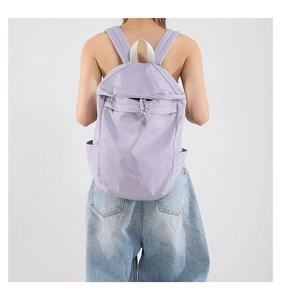 Close-up of light purple nylon backpack showing its large capacity and waterproof fabric