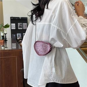 Sparkling pink heart-shaped mini crossbody bag with silver chain strap for women