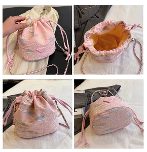 Detailed views of a pink bucket bag with colorful stitching and a metallic chain strap