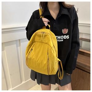 Ginger yellow nylon laptop backpack with large capacity and dual zipper front pockets