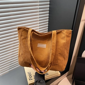 Caramel corduroy tote bag with shoulder straps and brand label for daily commute
