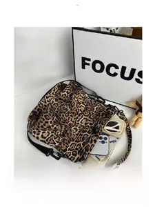 Interior view of leopard print crossbody bag showing large capacity for essentials