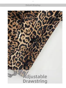 Detailed macro of leopard print bag with metal eyelets and adjustable black drawstring