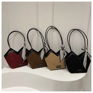 Detail view of four large tote bags in burgundy and black with chic silk scarves