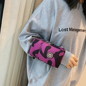 Mini sports crossbody bag in purple camo pattern for phone and coins with dual zippers