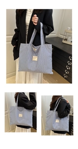 Detailed views of the large canvas tote bag with classic blue and white vertical stripes