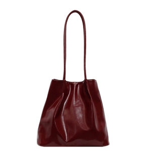Deep red vintage tote bag with glossy finish and slim shoulder straps for women
