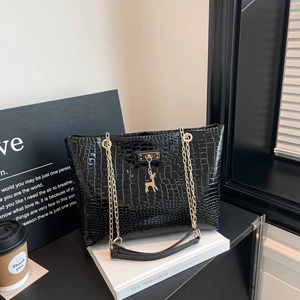 Glossy black crocodile pattern tote bag with gold chain and deer pendant charm