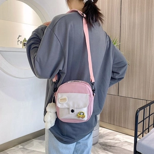 Pink and white nylon mini crossbody bag with cloud patch and white pompom charm for girls