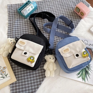 Mini nylon canvas messenger bags in black and blue colors with cute bear plush charm