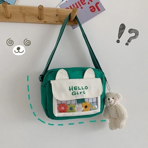 Cute green canvas crossbody bag with cartoon ears and plush bear charm for girls