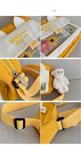 Detailed views of yellow nylon crossbody bag with white cat ears and a plush bear pendant