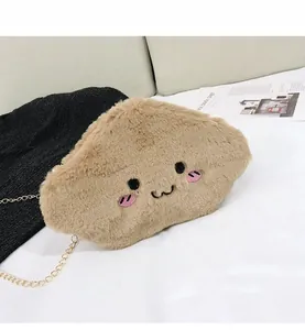 Detailed close-up of a brown plush cloud crossbody bag with cute facial embroidery