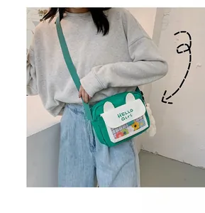 Cute green canvas crossbody bag with white ears and transparent flower window detail