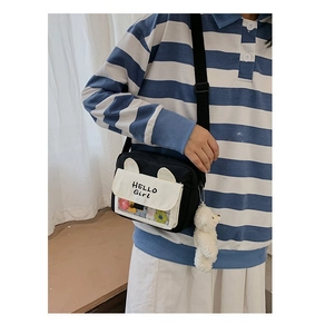 Detail of Hello Girl crossbody bag with transparent window and plush bear charm