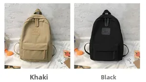Detail view of the khaki and black casual backpacks with MRMI leather logo patches